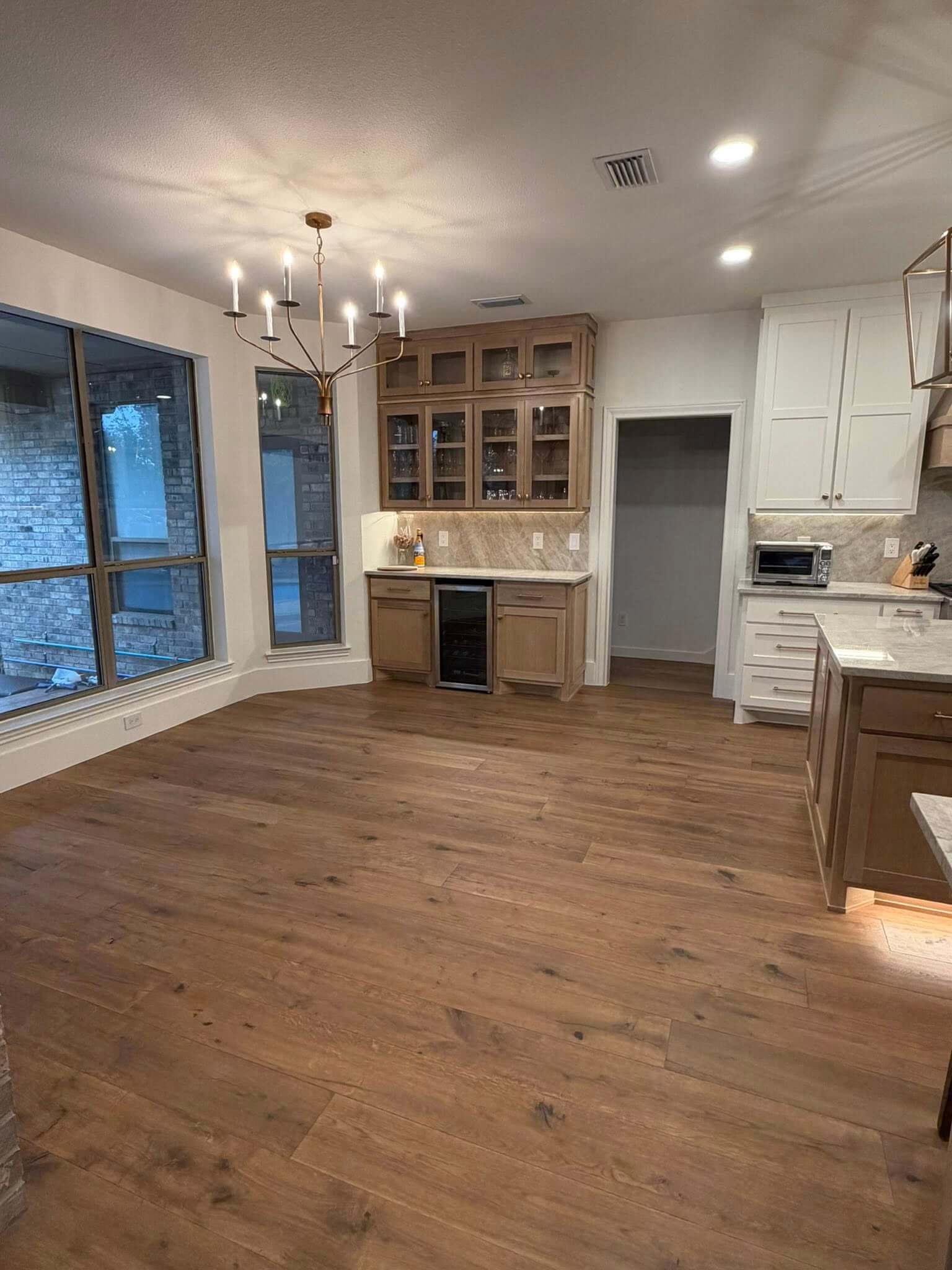 New flooring installed in kitchen and breakfast area during a kitchen remodel in Fair Oaks Ranch TX by Shaw Construction Services