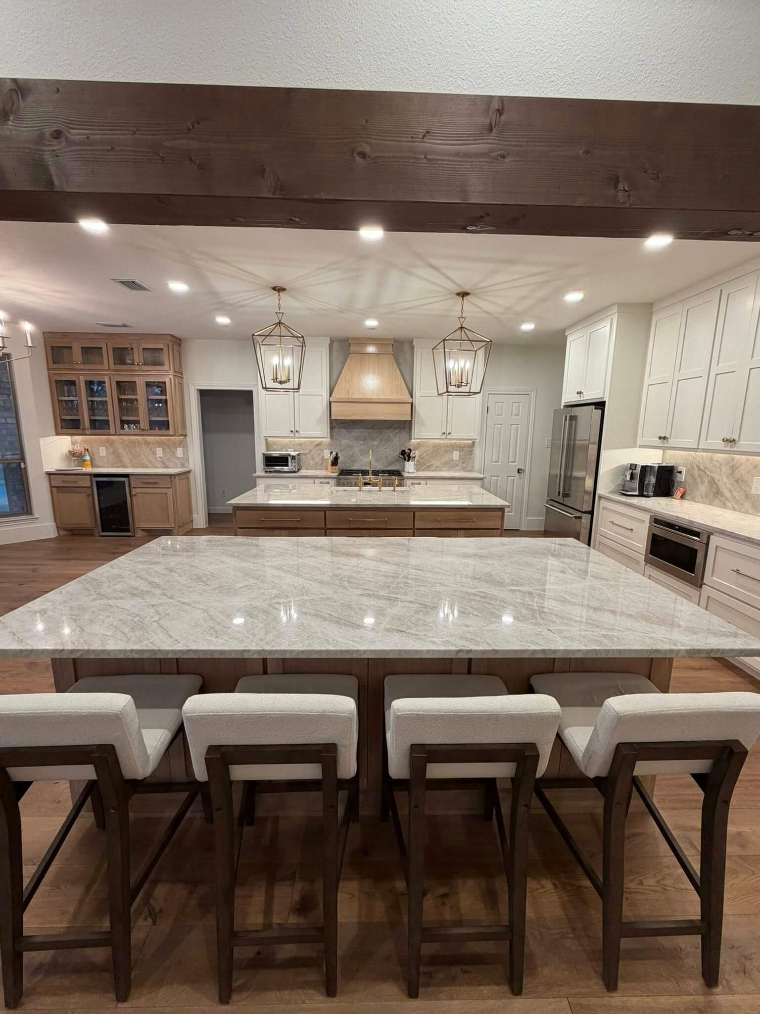New flooring, cabinets, countertops, and lighting installed during a kitchen remodel in Fair Oaks Ranch TX by Shaw Construction Services